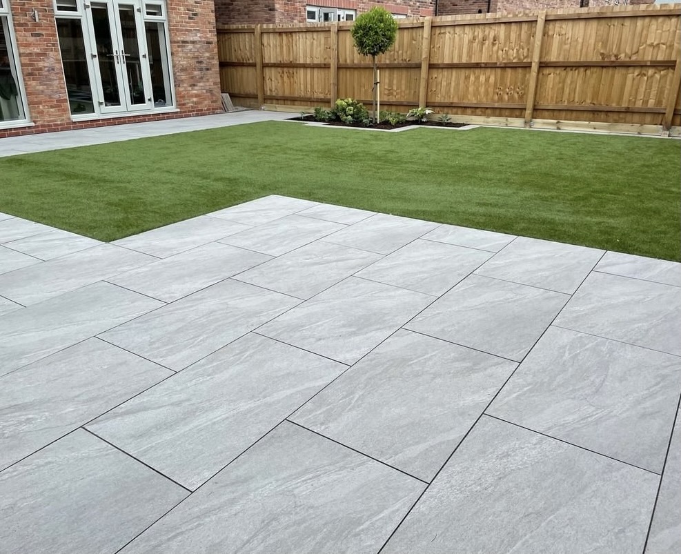 County Light Grey porcelain slabs in a garden