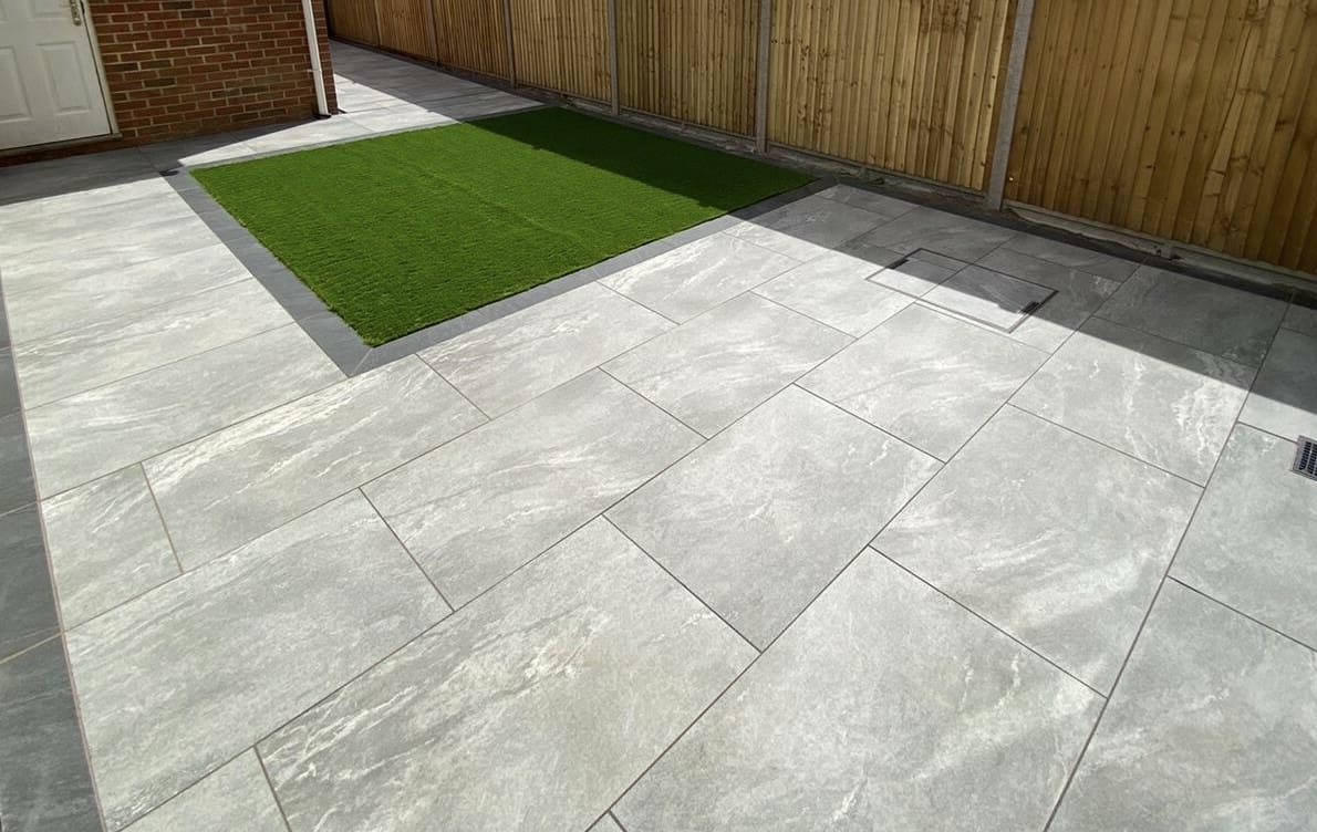 Earthcore grey porcelain slabs in a garden