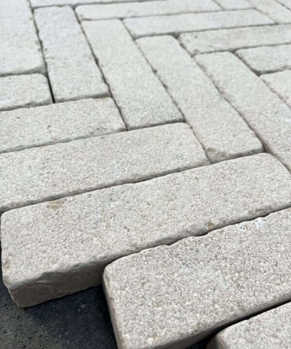 Millbrook Pearl Dual-Face Limestone Setts laid out in a pattern