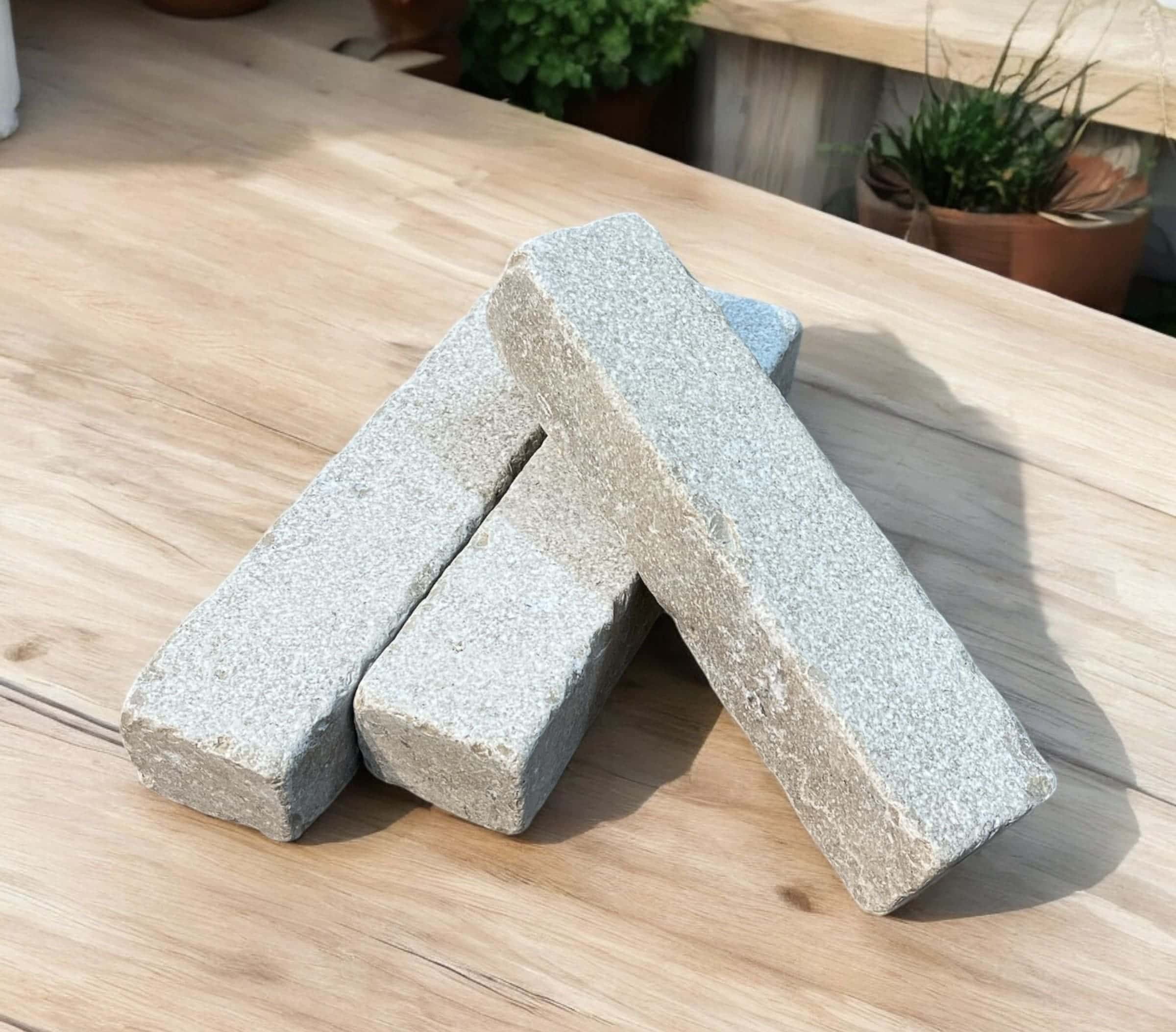 Millbrook Pearl Dual-Face Limestone Setts on a table